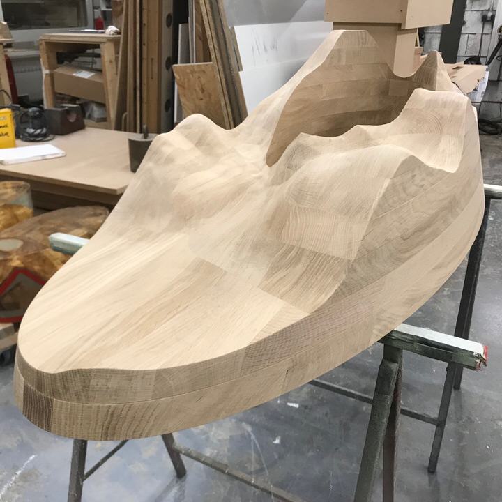 Assembly taking place - solid carved - table base